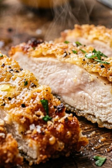 Ultra close-up macro of golden crispy air fryer parmesan crusted chicken cutlets
